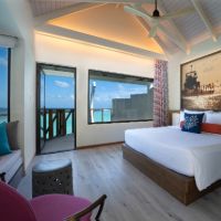 https://www.coloursofoblu.com/wp-content/uploads/2021/10/OBLU-XPERIENCE-AILAFUSHI-WATER-VILLA-BEDROOM-WITH-VIEW-4.jpg